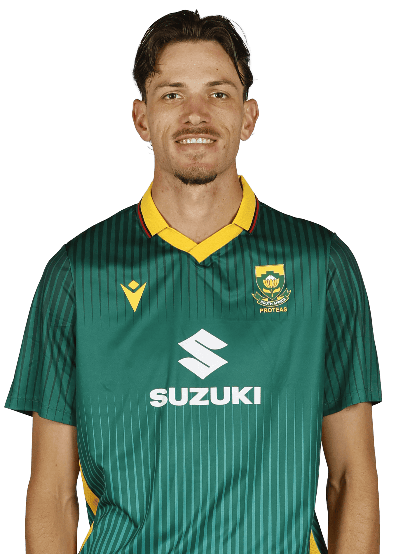 Head-and-shoulders portrait of a man in a green striped soccer jersey with a yellow collar and SA Proteas crest, smiling.