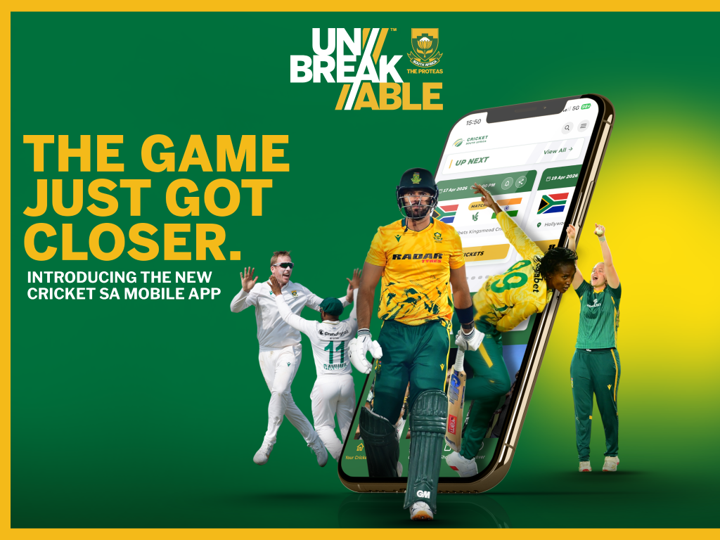 Green-and-gold Cricket South Africa app promo banner showing cheering players around a tilted smartphone displaying the app interface on a green background with bold 'THE GAME JUST GOT CLOSER' text